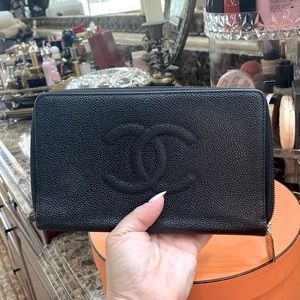 Chanel wallet black zip around large. Used in great condition. Silver hardware.